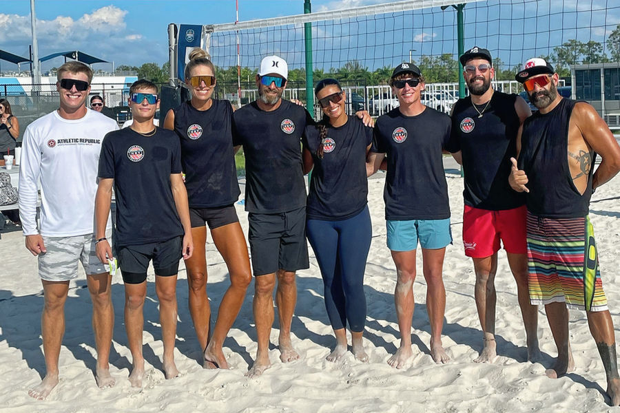 The Naples Beach Volleyball coaching staff together on the sand